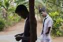 Kumarakulasingham Dinojan, 15, right, who lost his left hand below his wrist and has damaged finger…
