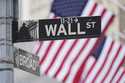 Wall Street signs are displayed outside the New York Stock Exchange in New York, Wednesday, April 2…