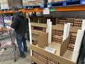 A consumer places a flat of eggs in a shopping cart in a Costco warehouse Tuesday, February 18, 202…