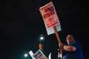 Machinist AJ Nelson, who has worked for Boeing for six years, works the picket line after union mem…